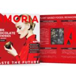 Amoria Dark Chocolate Brownies plant-based packaging, front and back panels in bold red design, with a woman holding a brownie, nutrition facts, ingredients, and product viewing window.