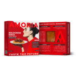 Amoria Bolognese Mince plant-based packaging, front and back panels in bold red design, with a woman holding spaghetti, nutrition facts, ingredients, and product viewing window.